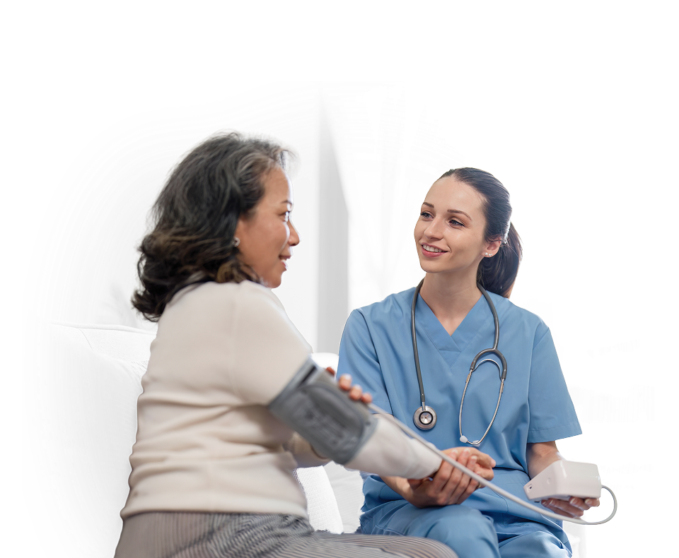 A home health nurse talking with a patient